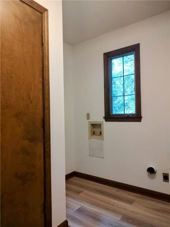 laundry room with baseboards, wood finished floors, washer hookup, and electric dryer hookup