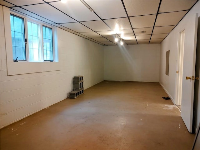 basement featuring a drop ceiling