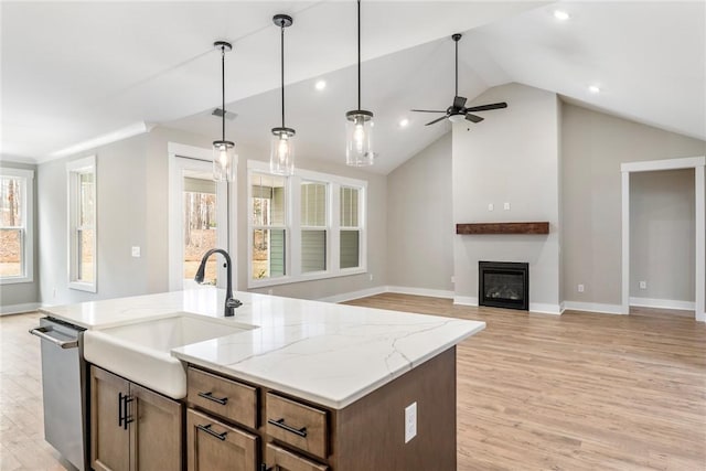 327 Thompson Rd, Taylors, SC 29687 - kitchen featuring dishwasher, a sink, open floor plan, baseboards, and lofted ceiling