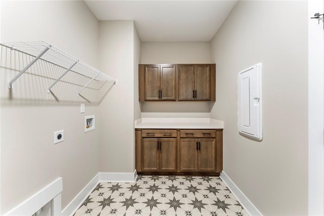 327 Thompson Rd, Taylors, SC 29687 - laundry room with hookup for an electric dryer, washer hookup, baseboards, light flooring, and cabinet space