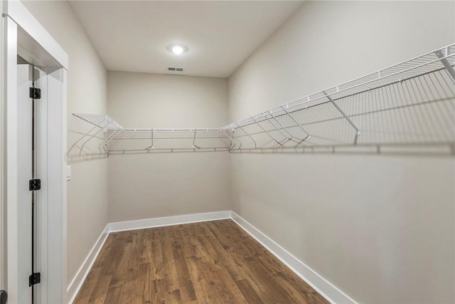 327 Thompson Rd, Taylors, SC 29687 - spacious closet featuring dark wood-type flooring