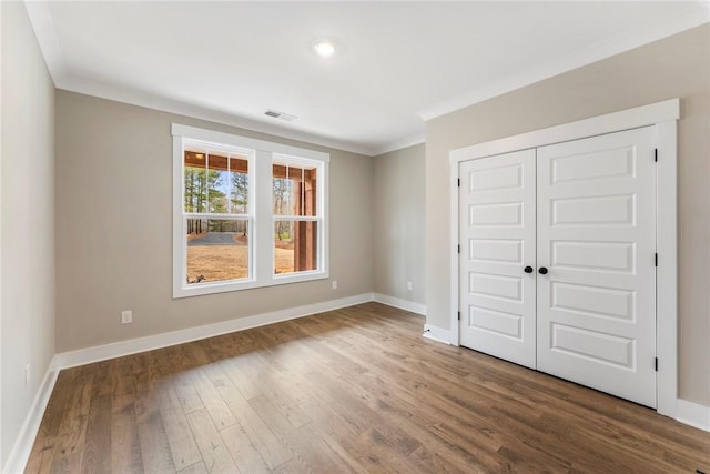 327 Thompson Rd, Taylors, SC 29687 - unfurnished bedroom with ornamental molding, wood finished floors, baseboards, and a closet
