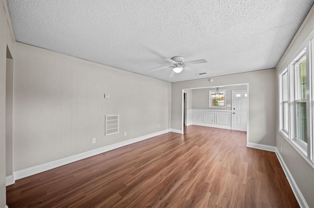 1922 Dobbins Ave, Anderson, SC 29625 - spare room with wood finished floors, ceiling fan, a textured ceiling, and baseboards