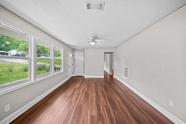 1922 Dobbins Ave, Anderson, SC 29625 - spare room featuring a textured ceiling, wood finished floors, a ceiling fan, and baseboards