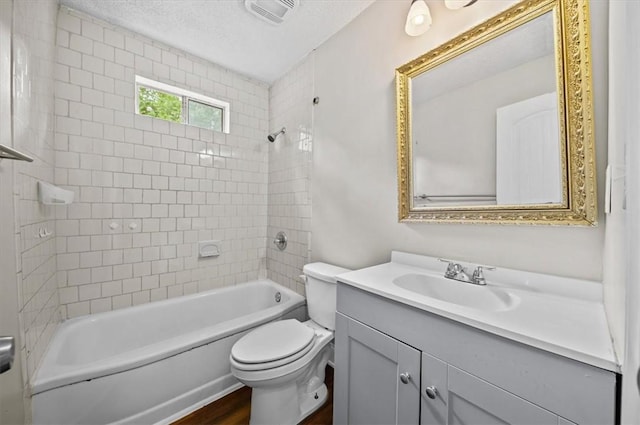 1922 Dobbins Ave, Anderson, SC 29625 - bathroom with toilet, vanity, shower / bathtub combination, a textured ceiling, and wood finished floors