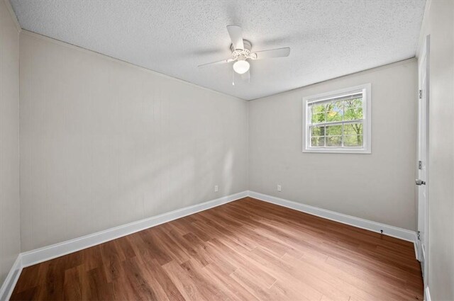 1922 Dobbins Ave, Anderson, SC 29625 - unfurnished room featuring wood finished floors, a textured ceiling, ceiling fan, and baseboards