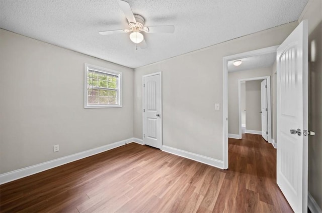 1922 Dobbins Ave, Anderson, SC 29625 - unfurnished bedroom with a textured ceiling, wood finished floors, baseboards, a closet, and ceiling fan
