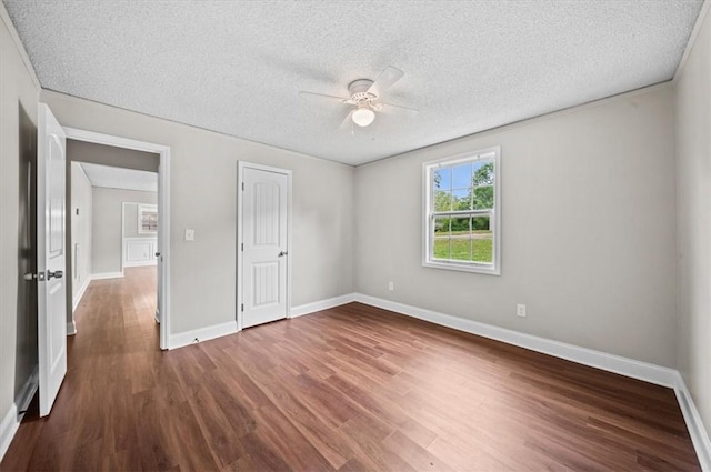 1922 Dobbins Ave, Anderson, SC 29625 - unfurnished bedroom featuring wood finished floors, a textured ceiling, baseboards, and a ceiling fan