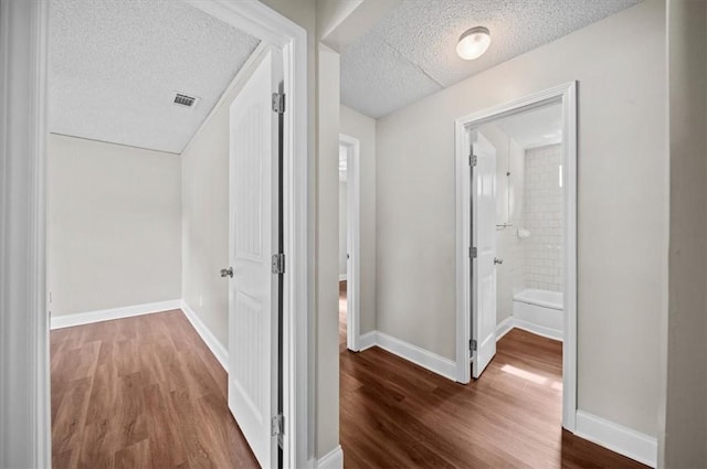 1922 Dobbins Ave, Anderson, SC 29625 - corridor featuring a textured ceiling, wood finished floors, and baseboards