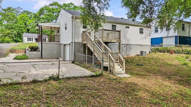 1922 Dobbins Ave, Anderson, SC 29625 - back of property featuring stairway, a fenced backyard, a garage, a deck, and central air condition unit