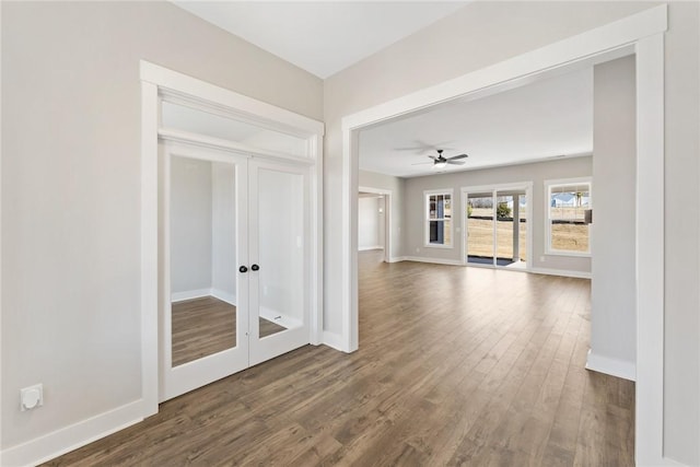 1002 Princeton Rd, Williamston, SC 29697 - empty room with french doors, dark wood finished floors, baseboards, and a ceiling fan