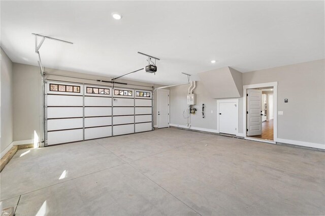 1002 Princeton Rd, Williamston, SC 29697 - garage with a garage door opener, baseboards, and recessed lighting