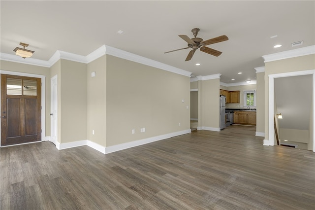 unfurnished living room with ornamental molding, ceiling fan, dark wood-style flooring, baseboards, and recessed lighting