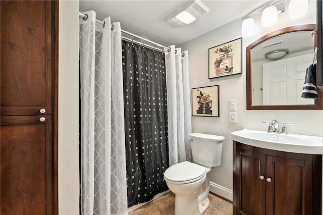 bathroom featuring toilet, vanity, tile patterned flooring, curtained shower, and baseboards