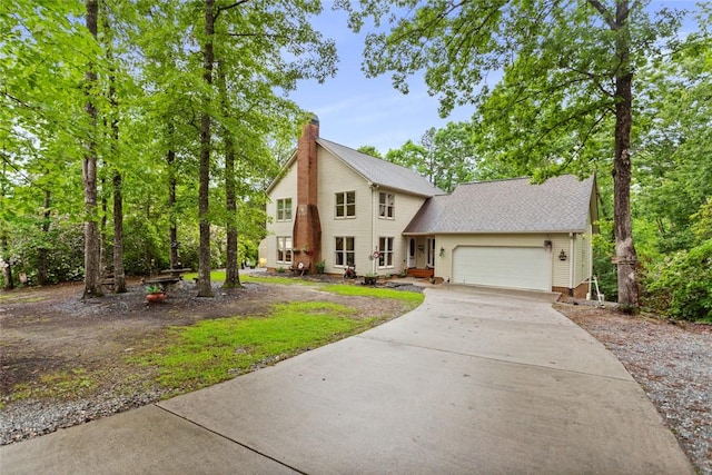 310 Fernwood Dr, Salem, SC 29676 - view of front facade with a garage, concrete driveway, a chimney, and roof with shingles