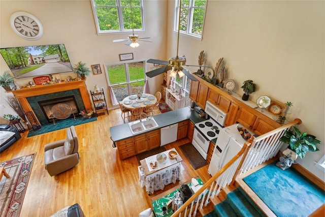 310 Fernwood Dr, Salem, SC 29676 - living room featuring ceiling fan, wood finished floors, a tile fireplace, and a high ceiling