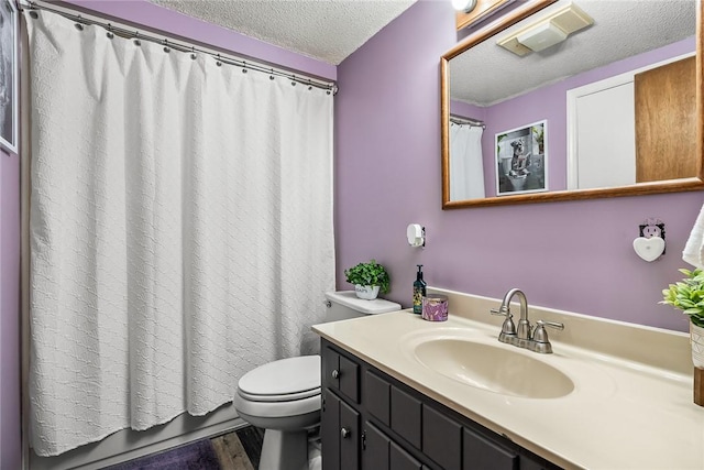 bathroom with a textured ceiling, toilet, wood finished floors, vanity, and a shower with shower curtain