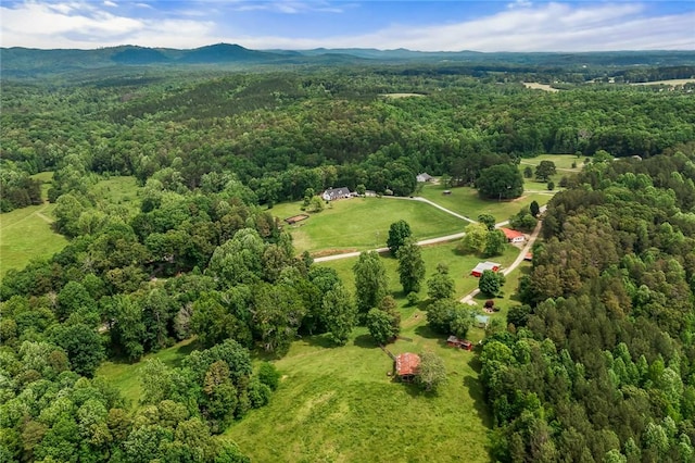 bird's eye view of a heavily wooded area and mountains