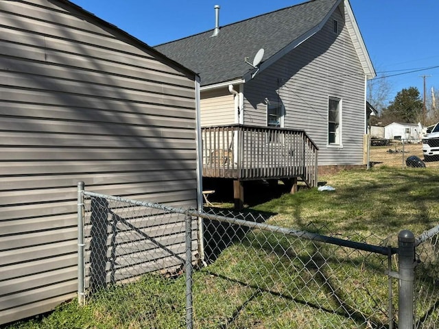 view of property exterior with a wooden deck and a shingled roof