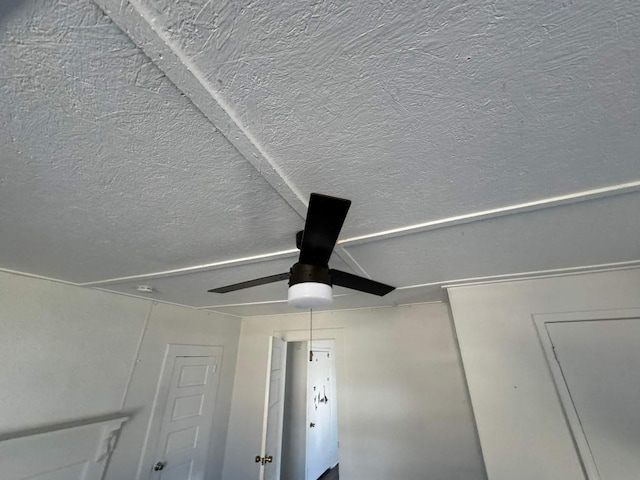 detailed view of a textured ceiling and a ceiling fan