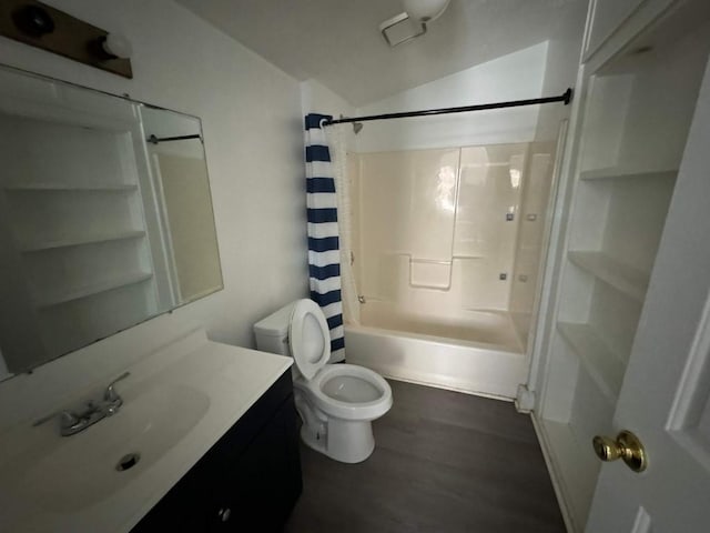bathroom featuring shower / bath combo with shower curtain, wood finished floors, toilet, and vanity