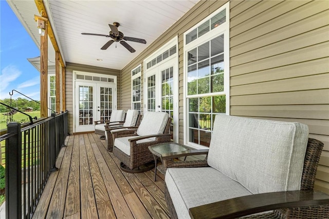 wooden terrace featuring french doors and a ceiling fan