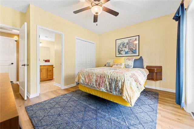 bedroom featuring light wood finished floors, a closet, and baseboards