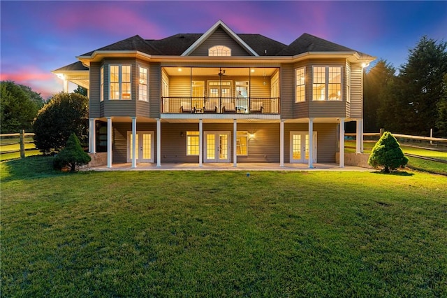 back of property featuring french doors, a patio area, and a deck