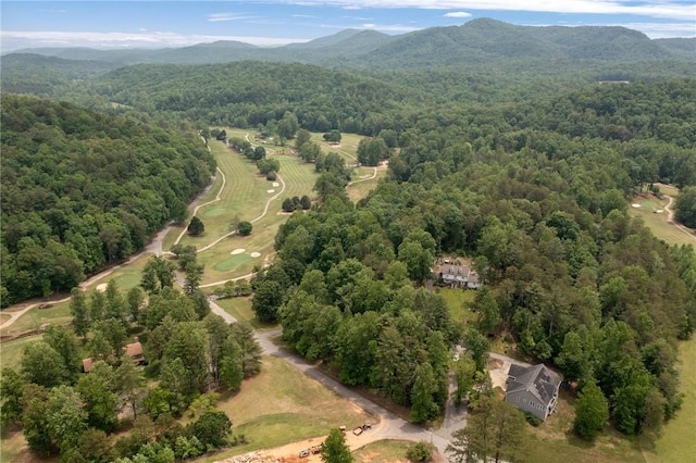 view of property location with a forest and mountains