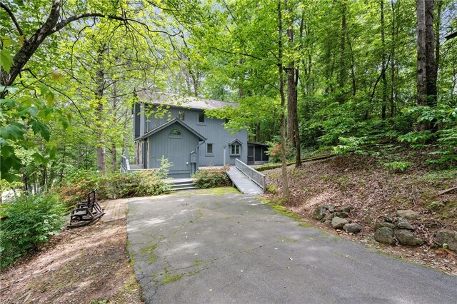 view of front of home featuring asphalt driveway