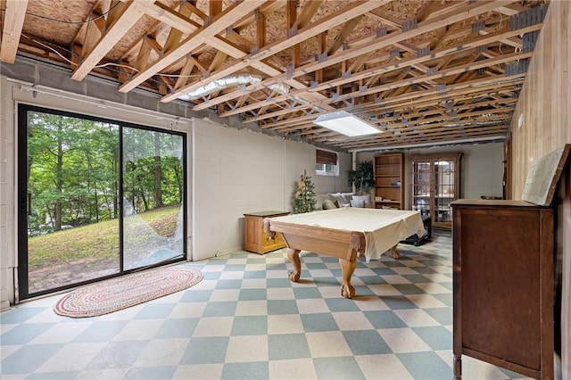 rec room featuring tile patterned floors, pool table, concrete block wall, and french doors