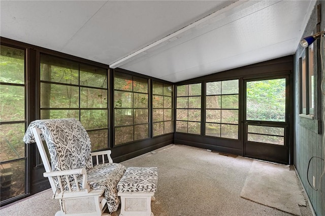 sunroom featuring vaulted ceiling