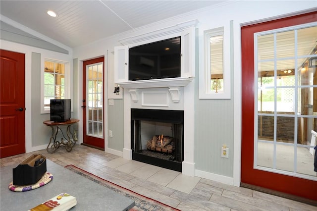 371 Store Rd, Easley, SC 29640 - living area featuring wood finished floors, a warm lit fireplace, baseboards, and lofted ceiling