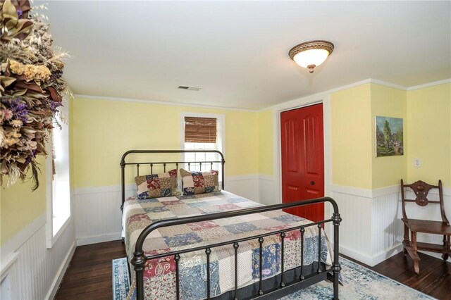 371 Store Rd, Easley, SC 29640 - bedroom with wood finished floors, wainscoting, multiple windows, and ornamental molding