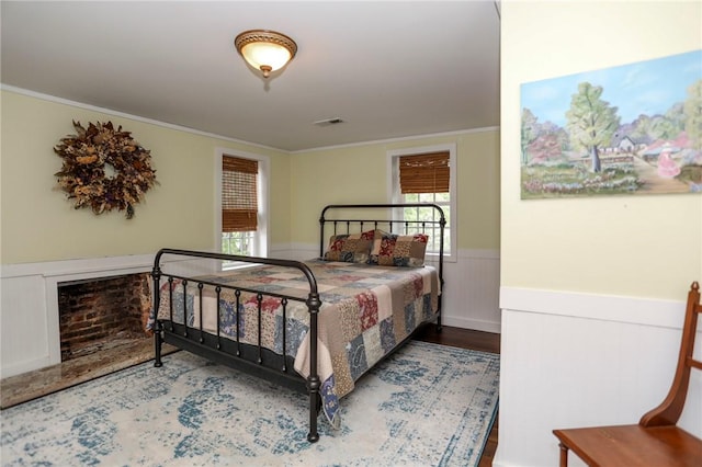 371 Store Rd, Easley, SC 29640 - bedroom with a wainscoted wall, crown molding, and wood finished floors