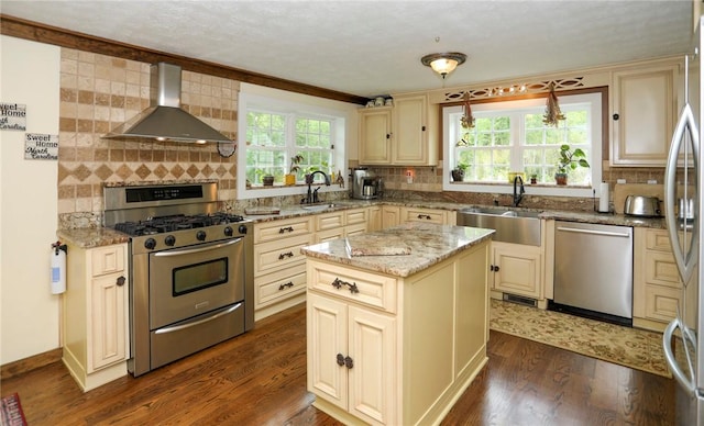 371 Store Rd, Easley, SC 29640 - kitchen with cream cabinets, stainless steel appliances, wall chimney range hood, and a sink