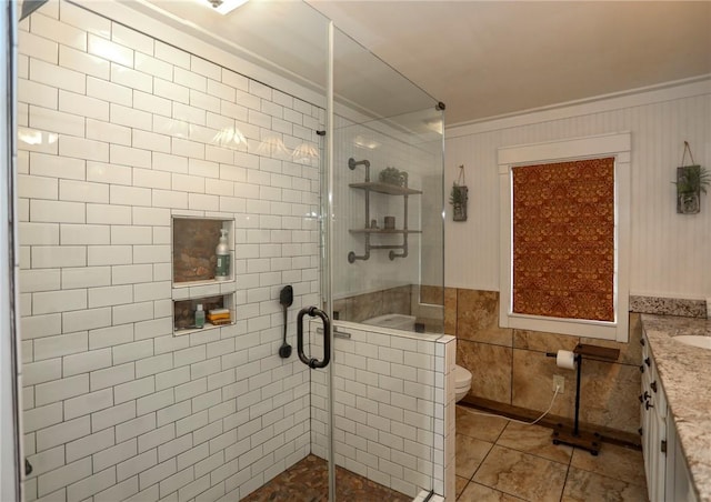 371 Store Rd, Easley, SC 29640 - full bathroom with a shower stall, toilet, vanity, tile patterned flooring, and ornamental molding