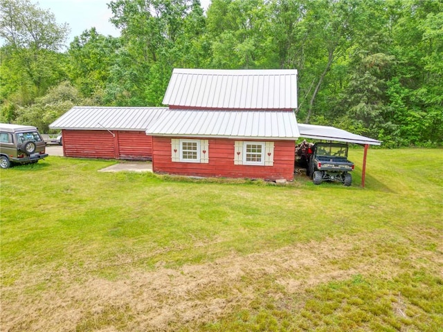 371 Store Rd, Easley, SC 29640 - view of side of property with a carport, a lawn, metal roof, and a wooded view