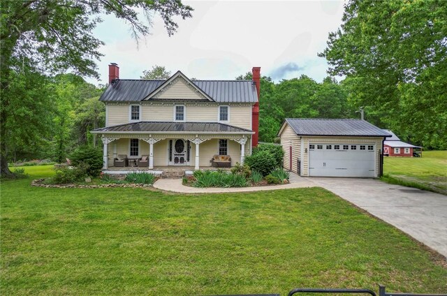 371 Store Rd, Easley, SC 29640 - view of front of home featuring a chimney, a porch, a front yard, and a garage