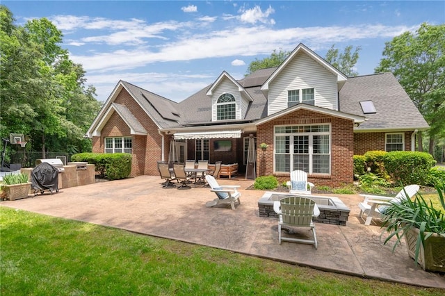 103 Crepe Myrtle Ln, Anderson, SC 29625 - rear view of house featuring brick siding, a patio, a shingled roof, and a fire pit