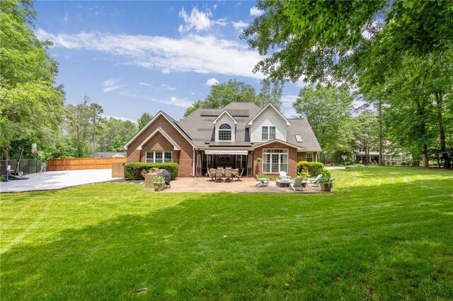 103 Crepe Myrtle Ln, Anderson, SC 29625 - back of property with a patio area, roof mounted solar panels, and brick siding