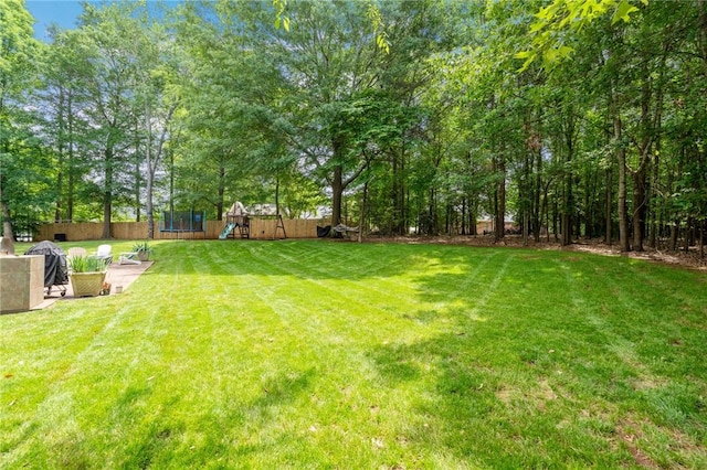 103 Crepe Myrtle Ln, Anderson, SC 29625 - view of yard with a trampoline and a playground
