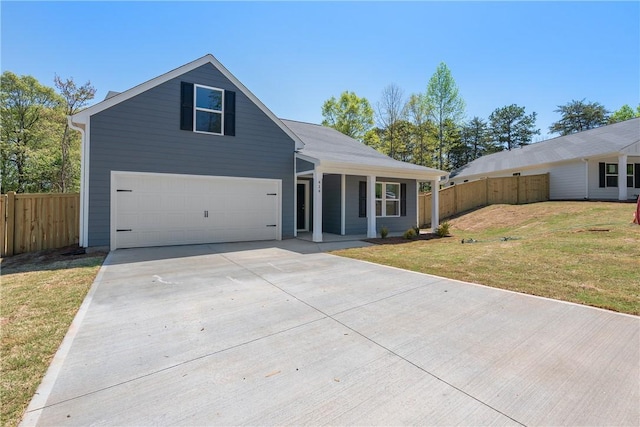 traditional-style house with concrete driveway, covered porch, and an attached garage