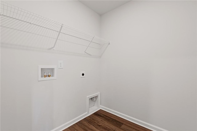 laundry room featuring hookup for an electric dryer, hookup for a washing machine, dark wood-style flooring, and baseboards