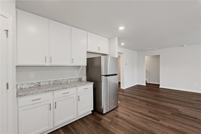kitchen featuring freestanding refrigerator, dark wood-type flooring, white cabinetry, baseboards, and recessed lighting