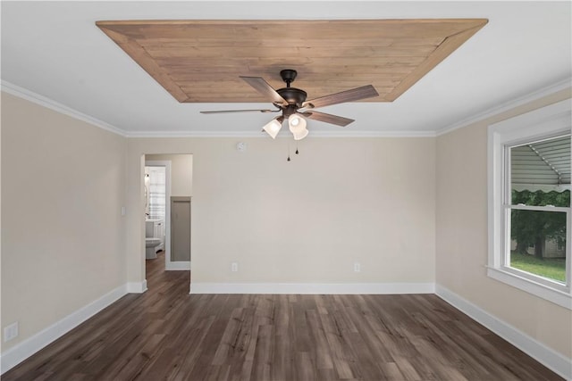 empty room featuring a ceiling fan, dark wood-style floors, baseboards, and crown molding