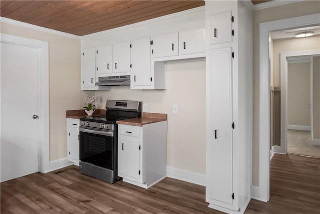 kitchen with stainless steel range with electric stovetop, under cabinet range hood, ornamental molding, dark wood-type flooring, and dark countertops