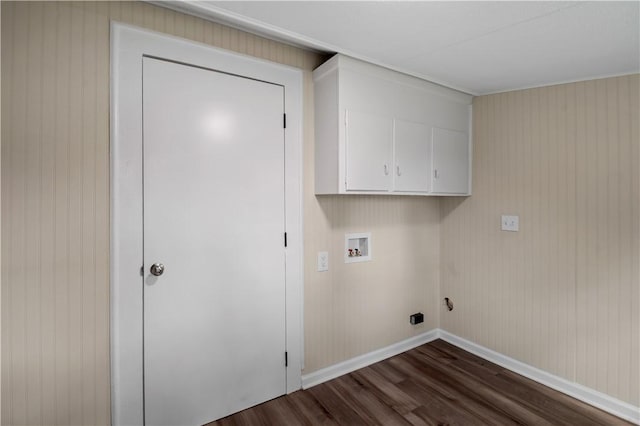 laundry area featuring hookup for a washing machine, cabinet space, dark wood finished floors, and baseboards