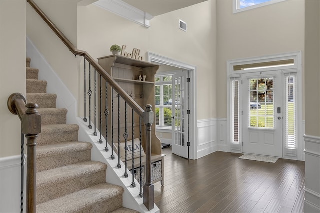 103 James Lake Way, Easley, SC 29642 - foyer entrance with plenty of natural light, a wainscoted wall, dark wood-style flooring, stairway, and a high ceiling