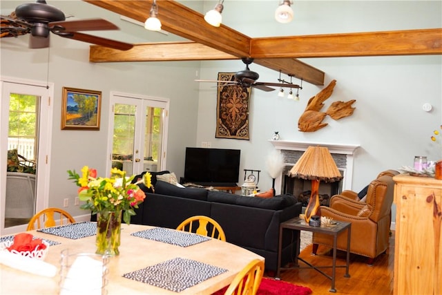 608 Mckinney Way, Westminster, SC 29693 - dining space featuring ceiling fan, beamed ceiling, a fireplace, and wood finished floors